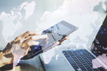 Wall Mural - multi exposure of abstract creative digital world map and finger presses on a digital tablet on back