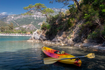 Fototapete - Summer landscape on  mediterranean place near Oludeniz, Turkey. Amazing travel on kayak on the sea. Stopping on rocky coastline.