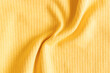  Waved ribbed cotton fabric texture pastel yellow color  . Close up rib cotton cloth and textiles pattern. Natural organic fabrics texture background.
