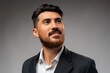 © fotofabrika - Portrait of handsome confident business on gray background