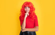 positive girl with red long hair on yellow background