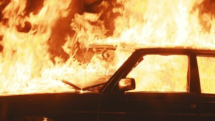 Burning car in flames as a result of the explosion