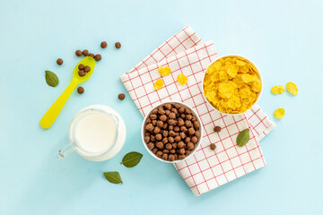 Wall Mural - Kids morning with corn flakes milk and orange for breakfast