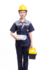 A female worker in a hard hat and uniform carrying a tool kit