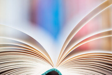 Wall Mural - Close-up of opened book pages with soft blurred background