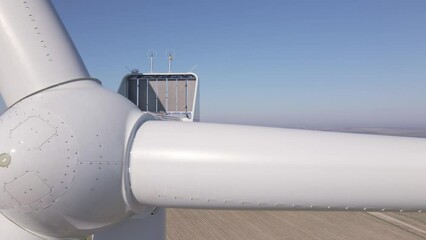 Canvas Print - Close up of wind turbine in field, Renewable energy made of windmill generator, Development of green wind energy due to energy crisis in Europe