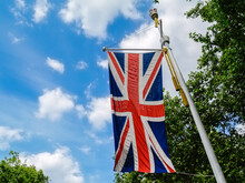 Union Jack Flag On United Kingdom Hanging From Pole Along The Mall