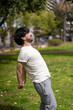 © Mariano - Portrait of handsome attractive mature bearded athletic latin man guy 40s doing stretching exercise, preparing for morning workout in the park.