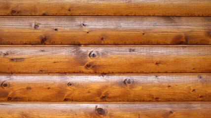 Wooden wall assembled of beams or logs. Natural building concept. Brown background nature idea