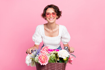 Sticker - Photo of excited pretty girl dressed white top heart eyewear riding bicycle isolated pink color background