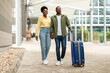 © Prostock-studio - African Spouses Traveling On Vacation Walking With Suitcase At Airport
