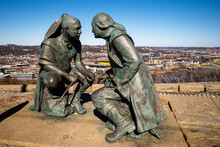 The Bronze Statue Of George Washington And Seneca Leader Guyasuta, In Pittsburgh, PA. Heinz Field Behind.