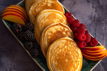 Wall Mural - Pancakes with fruits, berries, chocolate sauce and coconut chips