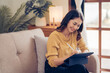 © Kritdanai - Confident pretty asian business woman working with laptop while doing some paperwork at home