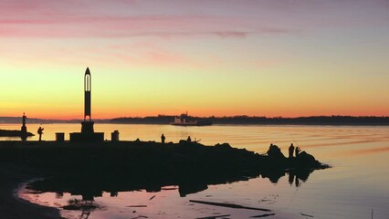 Wall Mural - Steveston Sunrise Fishing Richmond BC 4K UHD. Fisherman at Garry Point Park on the Fraser River in Steveston, British Columbia, Canada. 4K, UHD.
