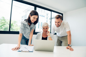 Wall Mural - Group of professional business people are working in conference room, Smiling businesspeople having a discussion in an office