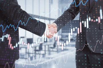 Canvas Print - Close up of businessmen shaking hands with creative glowing forex chart on blurry office interior background. Trade, finance, stats. Double exposure.