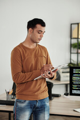 Wall Mural - software engineer writing down ideas