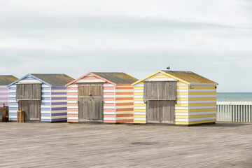 colourfull pier huts on hastings pier, copy space