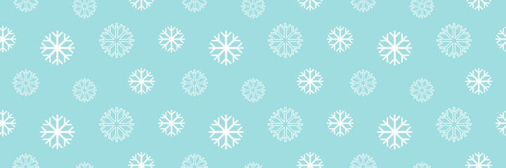 Wall Mural - Wide horizontal blue vector seamless pattern background with snowflakes for winter design.
