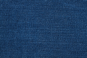 Macro jeans textured background. Blue denim pattern top view and copy space. Template blank backdrop. Fashion cloth pattern mockup. Top view flat lay vintage trousers material. Selective focus