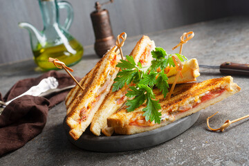 Sticker - Toast with ham and cheese served on sandwich plate on a stone table