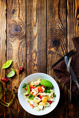 Wall Mural - dietary salad with chicken,basil, cucumber, Chinese cabbage. Top view