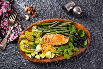 Canvas Print - Big summer dinner with grilled chicken, green beans , corn and other vegetables