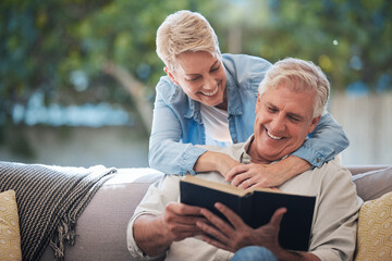 Wall Mural - Mature couple, bond and funny book on house or home sofa in garden and backyard patio. Smile, happy or relax senior man and elderly woman in retirement hug, trust or security love marriage with novel