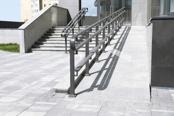 Outdoor stairs with ramp and metal railing
