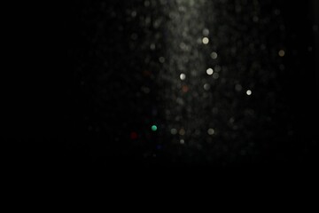 Wall Mural - blurred view of festive lights on black background. bokeh effect