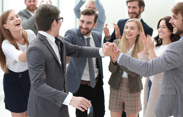 Wall Mural - boss and the gleeful business team standing together