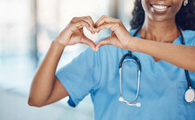Heart Hand And Black Woman Nurse In Hospital With Expression To Show Love And Care For Career. Professional Medical Facility Worker In Uniform With Happy Smile And Self Love Sign At Work.