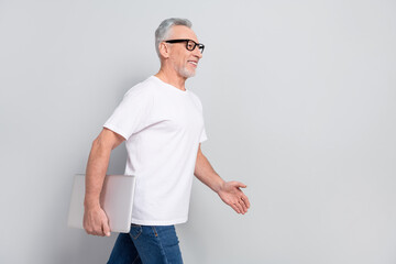 Sticker - Profile portrait of cheerful satisfied person walk look empty space isolated on grey color background