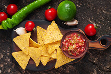 Mexican Nacho Chips And Salsa Dip In  Bowl On  Wooden Background