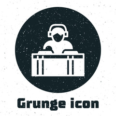 Sticker - Grunge DJ wearing headphones in front of record decks icon isolated on white background. DJ playing music. Monochrome vintage drawing. Vector