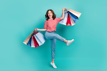 Poster - Full length photo of young nice girl wear striped t-shirt denim celebrate spree hold much package sale black friday crazy isolated on cyan color background