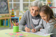 © aletia2011 - Portrait of grandmother and granddaughter drawing together