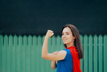 Strong Super Heroine Woman Showing Of Her Biceps . Vigilante Superhero Defending Her Neighborhood And Home