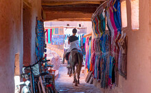 Beautiful Woman Rider Who Rides A Horse In The Streets Of Ait Ben Haddou Near Ouarzazate River - 
 Atlas Mountains, Morocco, North Africa 