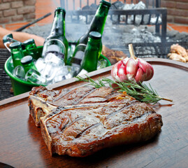 Wall Mural - T bone steak with trimmings, potato, salad, orange juice, bread