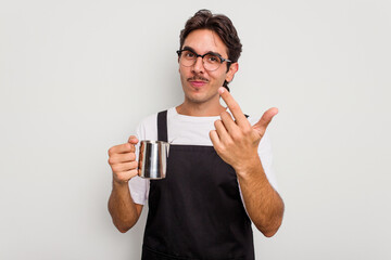 Wall Mural - Young hispanic barista man isolated on white background pointing with finger at you as if inviting come closer.