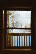 Traveler In Snowy Countryside Behind Window