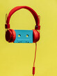 © ADDICTIVE STOCK - Retro cassette in headphones on yellow background