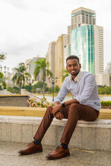 Poster - Handsome young black businessman at park outdoors during summer