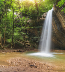 Wall Mural - Spring waterfall flow.