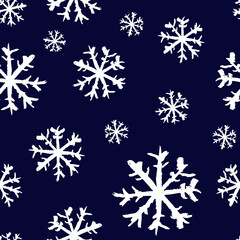 Wall Mural - Small white ink snowflakes isolated on dark blue background. Cute monochrome Christmas seamless pattern. Vector simple flat graphic hand drawn illustration. Texture.