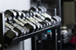 © Ilya - Dumbbell wall blurry home gym set storage rig equipment, from studio taking in heavy and man strong, power hard. ,