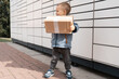 Parcel delivery, pickup point with lockers, kid with parcel, contactless pack delivery. Child parcel, boy using self service parcel terminal machine to send or receive package
