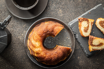 Poster - Sweet sponge cake. Bundt cake on dark table.